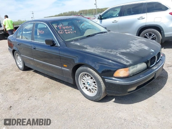 1999 BMW 5 Series 528iA with VIN WBADM6331XBY29010, listed as a IAAI auction lot 42103420 with 196,575 mi miles. Bid and sale history available at carsss.com. Image 1.