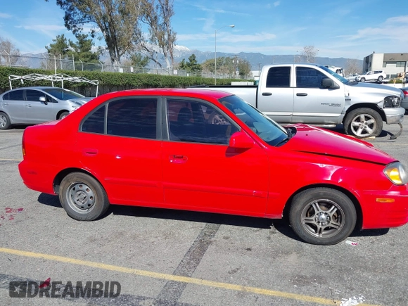 2003 Hyundai Accent GL with VIN KMHCG45C93U487209, listed as a IAAI auction lot 41590636 with 118,811 mi miles. Bid and sale history available at carsss.com. Image 13.