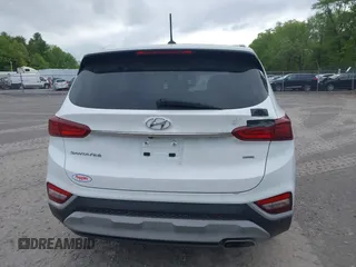 2019 Hyundai Santa Fe SE with VIN 5NMS2CAD9KH117777, listed as a IAAI auction lot 42296811 with 82,188 mi miles and . Bid and sale history available at DreamBid. Image 16.