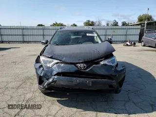 2017 Toyota RAV4 LE with VIN JTMBFREVXHJ146587, listed as a Copart auction lot 64794935 with 92,192 mi miles and Salvage title. Bid and sale history available at DreamBid. Image 13.