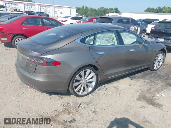 2016 Tesla Model S 70 with VIN 5YJSA1E1XGF126620, listed as a IAAI auction lot 40227035 with 71,400 mi miles and . Bid and sale history available at DreamBid. Image 4.