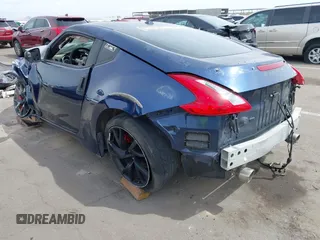 2013 Nissan 370Z z VIN JN1AZ4EH2DM380511, wystawiony jako IAAI lot #41912193 z przebiegiem Nie podano mil oraz . Historia ofert i sprzedaży dostępna na DreamBid. Obrazek 3.