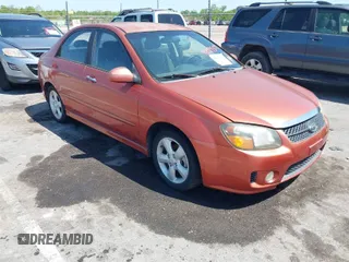 2009 Kia Spectra EX with VIN KNAFE221195026956, listed as a IAAI auction lot 42019309 with 121,341 mi miles. Bid and sale history available at carsss.com. Image 1.