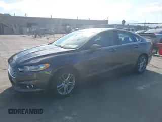 2016 Ford Fusion SE Hybrid z VIN 3FA6P0LU6GR145421, wystawiony jako IAAI lot #42650918 z przebiegiem 105 990 mil mil oraz . Historia ofert i sprzedaży dostępna na DreamBid. Obrazek 18.
