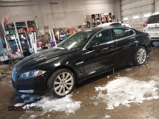 2014 Jaguar XF V6 SC with VIN SAJWJ0EF2E8U13746, listed as a IAAI auction lot 41608420 with 141,476 mi miles. Bid and sale history available at carsss.com. Image 2.