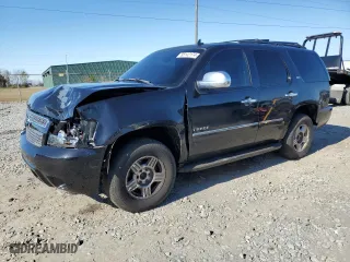 2011 Chevrolet Tahoe LTZ with VIN 1GNSCCE02BR320548, listed as a Copart auction lot 85142174 with 258,669 mi miles and Salvage Title. Bid and sale history available at carsss.com. Image 1.