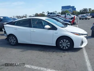 2021 Toyota Prius LE with VIN JTDKAMFP7M3197111, listed as a IAAI auction lot 42031569 with 240,098 mi miles and . Bid and sale history available at DreamBid. Image 14.