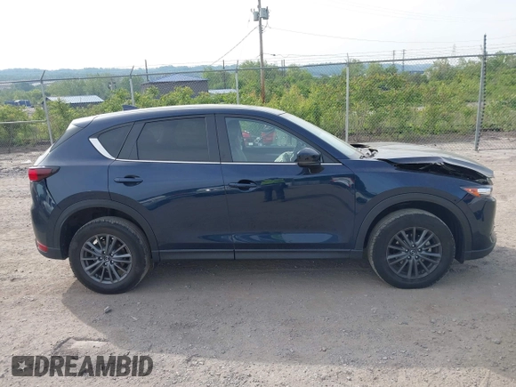 2021 Mazda CX-5 Touring z VIN JM3KFBCMXM0389857, wystawiony jako IAAI lot #42309650 z przebiegiem 49 938 mil mil oraz . Historia ofert i sprzedaży dostępna na DreamBid. Obrazek 13.
