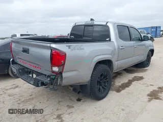 2021 Toyota Tacoma SR with VIN 5TFAX5GN7MX192500, listed as a IAAI auction lot 41674939 with 33,608 mi miles and . Bid and sale history available at DreamBid. Image 4.