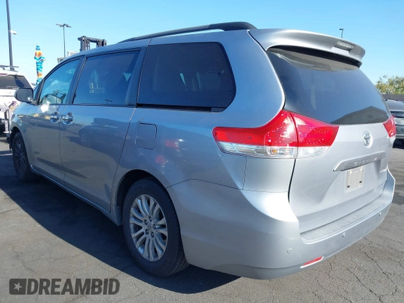 2013 Toyota Sienna XLE AAS with VIN 5TDYK3DC8DS318180, listed as a IAAI auction lot 42374479 with 189,977 mi miles and . Bid and sale history available at DreamBid. Image 3.