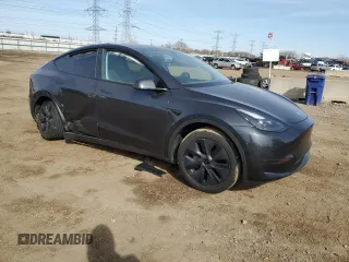 2024 Tesla Model Y with VIN 7SAYGDED7RF163537, listed as a Copart auction lot 48639255 with 7,193 mi miles and Salvage Title. Bid and sale history available at DreamBid. Image 4.