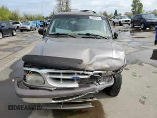 1996 Ford Explorer XL z VIN 1FMDU34X6TZB71667, wystawiony jako Copart lot #51969375 z przebiegiem 226 288 mil mil oraz Szkody całkowita. Historia ofert i sprzedaży dostępna na DreamBid. Obrazek 5.