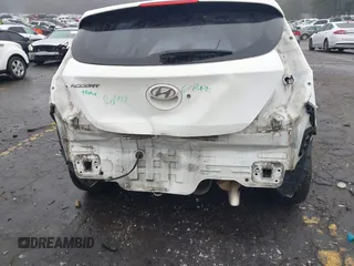 2014 Hyundai Accent SE with VIN KMHCU5AE8EU145629, listed as a IAAI auction lot 41497848 with 134,919 mi miles. Bid and sale history available at carsss.com. Image 6.