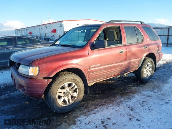 2002 Isuzu Rodeo z VIN 4S2DM58W124319936, wystawiony jako IAAI lot #41555285 z przebiegiem 143 035 mil mil oraz . Historia ofert i sprzedaży dostępna na DreamBid. Obrazek 17.
