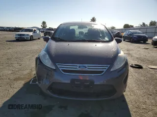 2013 Ford Fiesta SE z VIN 3FADP4BJ9DM186382, wystawiony jako Copart lot #67754934 z przebiegiem 157 495 mil mil oraz Szkoda całkowita • Salvage title. Historia ofert i sprzedaży dostępna na DreamBid. Obrazek 5.