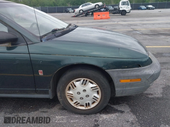 1998 Saturn SL с VIN 1G8ZH5280WZ295857, выставлен на аукционе IAAI как лот 42238789 с пробегом 153 163 миль миль и . История ставок и продаж доступна на DreamBid. Изображение 6.