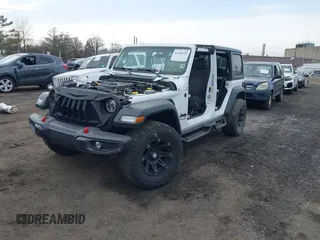 2021 Jeep Wrangler Unlimited Sport S with VIN 1C4HJXDN0MW612698, listed as a IAAI auction lot 41649323 with 22,539 mi miles and . Bid and sale history available at DreamBid. Image 2.