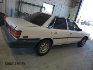 1991 Toyota Camry z VIN 4T1SV24E0MU402588, wystawiony jako Copart lot #82920114 z przebiegiem 124 644 mil mil oraz Szkoda całkowita • Salvage title. Historia ofert i sprzedaży dostępna na DreamBid. Obrazek 3.