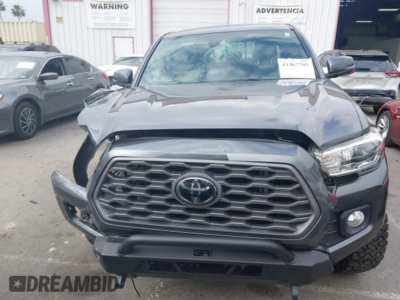 2021 Toyota Tacoma SR z VIN 3TMCZ5AN9MM397611, wystawiony jako IAAI lot #41467705 z przebiegiem 65 191 mil mil oraz . Historia ofert i sprzedaży dostępna na DreamBid. Obrazek 12.