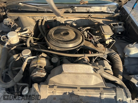 1987 Buick Regal with VIN 1G4GJ11Y4HP413978, listed as a Copart auction lot 87311954 with 52,519 mi miles and Salvage Title. Bid and sale history available at DreamBid. Image 7.