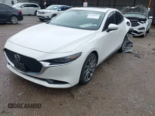 2023 Mazda 3 S Premium with VIN 3MZBPBDM6PM371326, listed as a IAAI auction lot 42138373 with 24,865 mi miles and . Bid and sale history available at DreamBid. Image 2.