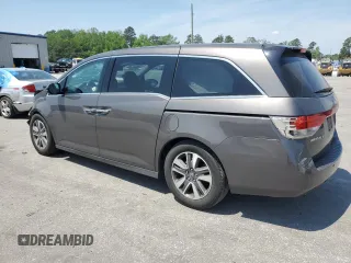 2014 Honda Odyssey Touring with VIN 5FNRL5H93EB061754, listed as a Copart auction lot 55182015 with 168,058 mi miles and Salvage title. Bid and sale history available at DreamBid. Image 2.