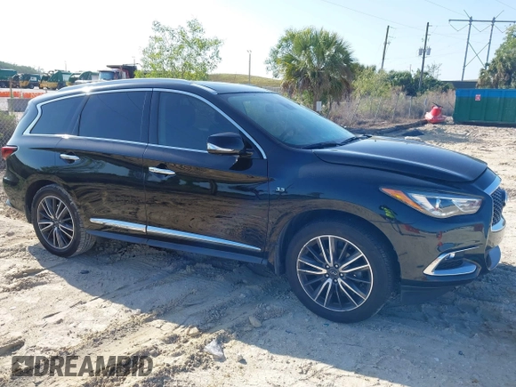 2020 Infiniti QX60 Pure with VIN 5N1DL0MN4LC539573, listed as a IAAI auction lot 42010032 with 104,507 mi miles and . Bid and sale history available at DreamBid. Image 13.