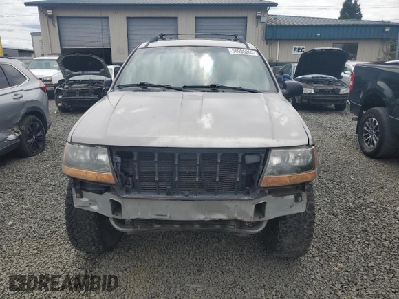 2000 Jeep Grand Cherokee Laredo with VIN 1J4GW48S9YC390448, listed as a Copart auction lot 56985265 with Not provided miles and Salvage title. Bid and sale history available at DreamBid. Image 5.