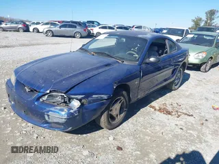 1996 Ford Mustang with VIN 1FALP4042TF140884, listed as a IAAI auction lot 41279611 with 233,047 mi miles. Bid and sale history available at carsss.com. Image 2.