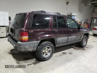 1997 Jeep Grand Cherokee Laredo with VIN 1J4GZ58S6VC573007, listed as a Copart auction lot 42728355 with 164,269 mi miles and Salvage Title. Bid and sale history available at carsss.com. Image 3.