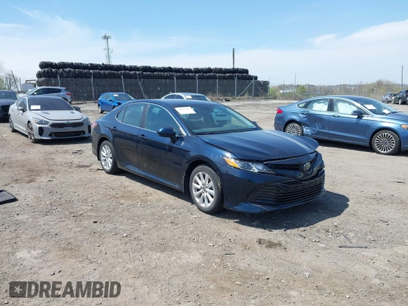 2019 Toyota Camry LE with VIN 4T1B11HK6KU276644, listed as a IAAI auction lot 42037249 with 23,677 mi miles and . Bid and sale history available at DreamBid. Image 1.