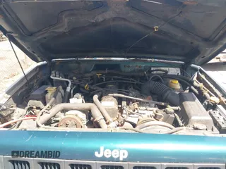 1998 Jeep Cherokee Sport with VIN 1J4FJ68S6WL151698, listed as a IAAI auction lot 42100846 with 239,466 mi miles. Bid and sale history available at carsss.com. Image 10.