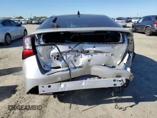 2022 Toyota Prius L Eco with VIN JTDKAMFU6N3174068, listed as a Copart auction lot 50403295 with 102,265 mi miles and Salvage Title. Bid and sale history available at DreamBid. Image 6.
