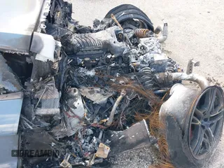 2021 Audi R8 z VIN WUAKBAFX5M7900468, wystawiony jako IAAI lot #41214857 z przebiegiem Nie podano mil oraz . Historia ofert i sprzedaży dostępna na DreamBid. Obrazek 6.