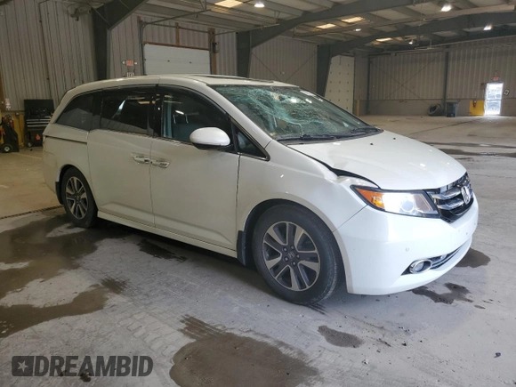 2016 Honda Odyssey Touring Elite with VIN 5FNRL5H91GB070424, listed as a Copart auction lot 55583075 with 115,709 mi miles and Salvage Title. Bid and sale history available at DreamBid. Image 4.