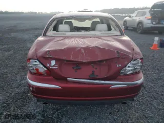2004 Jaguar X-Type with VIN SAJEA51C54WD60087, listed as a Copart auction lot 77611854 with 0 mi miles and Salvage Title. Bid and sale history available at carsss.com. Image 6.