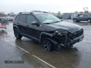 2016 Jeep Cherokee Trailhawk with VIN 1C4PJMBS5GW304062, listed as a IAAI auction lot 41756813 with 112,671 mi miles. Bid and sale history available at carsss.com. Image 1.