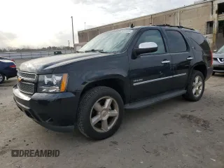 2012 Chevrolet Tahoe LTZ with VIN 1GNSKCE02CR173734, listed as a Copart auction lot 50291805 with 223,962 mi miles and Salvage title. Bid and sale history available at DreamBid. Image 1.
