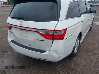 2013 Honda Odyssey Touring with VIN 5FNRL5H99DB041328, listed as a IAAI auction lot 41797520 with 148,523 mi miles and . Bid and sale history available at carsss.com. Image 6.