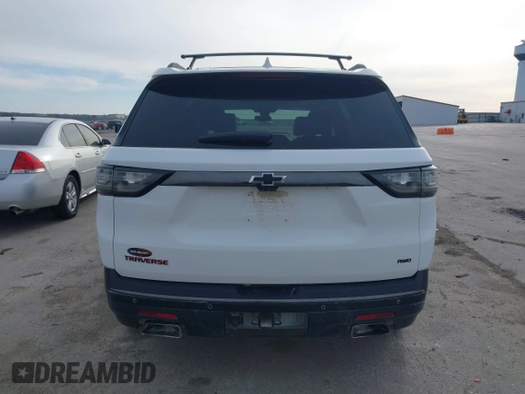 2018 Chevrolet Traverse Premier z VIN 1GNEVJKW0JJ229036, wystawiony jako IAAI lot #41866737 z przebiegiem 126 794 mil mil oraz . Historia ofert i sprzedaży dostępna na DreamBid. Obrazek 17.