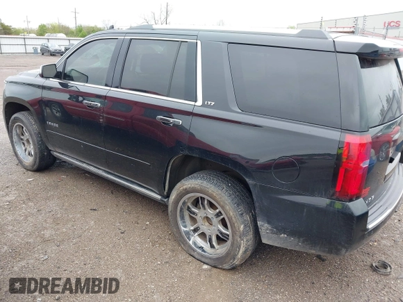 2016 Chevrolet Tahoe LTZ with VIN 1GNSKCKC7GR171904, listed as a IAAI auction lot 41967060 with 223,334 mi miles and . Bid and sale history available at DreamBid. Image 3.