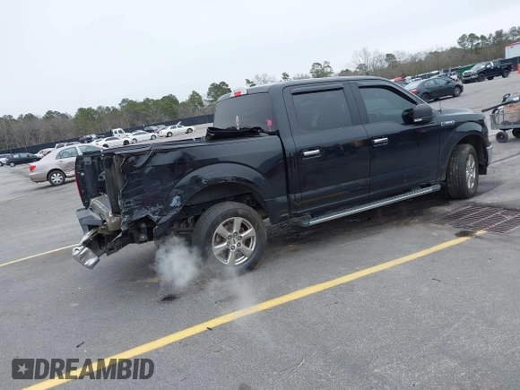 2020 Ford F-150 XL with VIN 1FTEW1C46LFA27536, listed as a IAAI auction lot 41372224 with 96,176 mi miles. Bid and sale history available at carsss.com. Image 4.