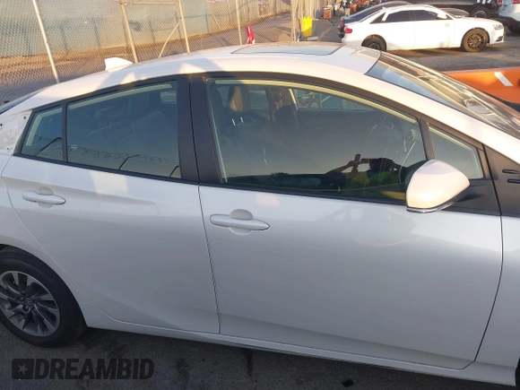 2022 Toyota Prius L Eco with VIN JTDKAMFU1N3181302, listed as a IAAI auction lot 41412650 with 92,397 mi miles and . Bid and sale history available at DreamBid. Image 14.