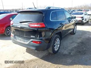 2015 Jeep Cherokee North with VIN 1C4PJMCS4FW792918, listed as a IAAI auction lot 41748651 with 107,034 mi miles. Bid and sale history available at carsss.com. Image 4.