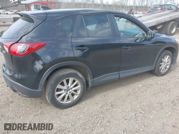 2014 Mazda CX-5 Sport with VIN JM3KE4BE4E0426931, listed as a IAAI auction lot 42055582 with 121,418 mi miles. Bid and sale history available at carsss.com. Image 4.