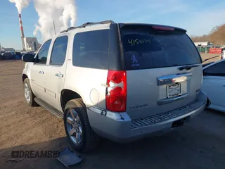 2014 GMC Yukon SLT with VIN 1GKS2CE00ER225071, listed as a IAAI auction lot 41581341 with 113,212 mi miles. Bid and sale history available at carsss.com. Image 3.