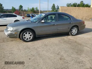2001 Mercury Sable with VIN 1MEFM53U21A611670, listed as a Copart auction lot 57449775 with 195,031 mi miles and Salvage title. Bid and sale history available at DreamBid. Image 1.