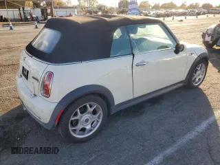 2007 MINI Convertible S with VIN WMWRH33567TL94957, listed as a Copart auction lot 42127775 with 90,401 mi miles and Salvage title. Bid and sale history available at DreamBid. Image 3.