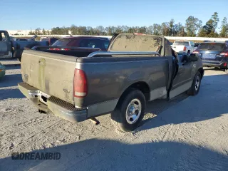 2002 Ford F-150 XL with VIN 1FTRF17W42NA89079, listed as a Copart auction lot 76519634 with Not Provided miles and Salvage Title. Bid and sale history available at carsss.com. Image 3.