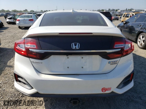 2018 Honda Clarity Touring z VIN JHMZC5F33JC002904, wystawiony jako Copart lot #55535325 z przebiegiem Nie podano mil oraz Szkoda całkowita • Salvage title. Historia ofert i sprzedaży dostępna na DreamBid. Obrazek 6.